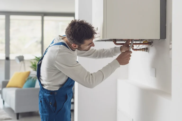 A technician installing a boiler